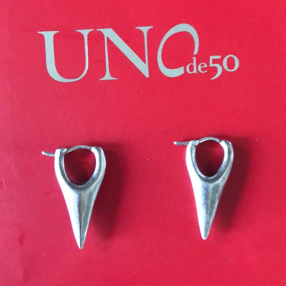 Uno de 50 silver plated earrings.